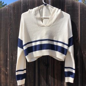 Short hoodie, fits loose and and thin,a navy blue strip the rest is creamy white